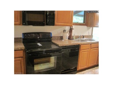 New appliances and maple cabinetry and tile floors