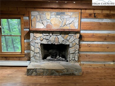 Stone Fireplace with gas logs.