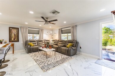 Living area with recessed lighting, baseboards, vi