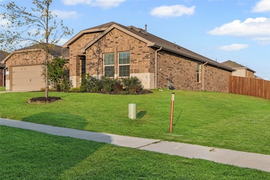 Ranch-style home with brick siding and an attached garage