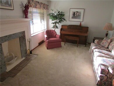 Spacious Living Room With Decorator Fireplace Whic