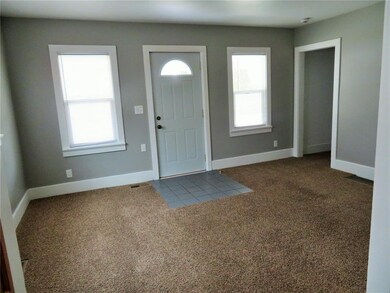 Living room- tasteful and neutral colors.