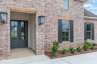 Property entrance featuring french doors