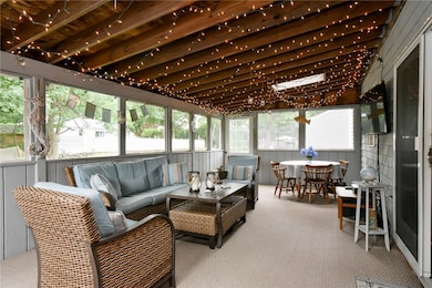 Screened in back porch with slider to kitchen and