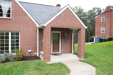 Closer view of the covered front entrance  step in
