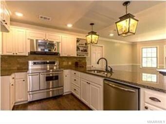 Kitchen with granite countertops and stainless ste
