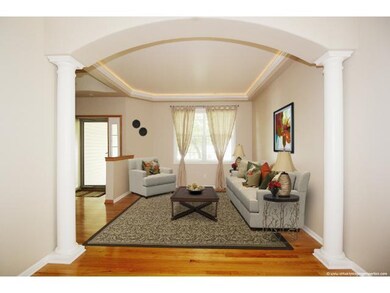 Front living room with lighted cove molding and wo