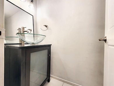 Bathroom featuring vanity and tile patterned flooring