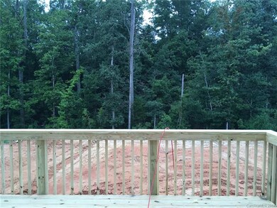 Wooded common open space behind the home will rema