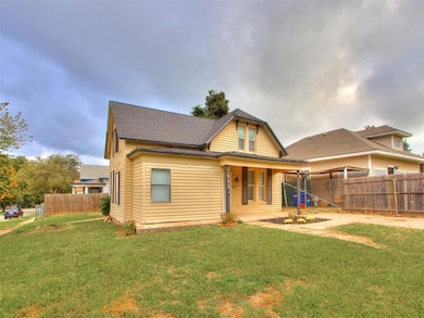 View of front facade with a porch and a shingled roof