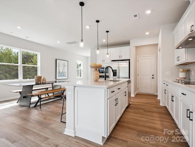 Large Central Island Ideal For Entertaining or Casual Dining.  *Model Photos | Actual Finishes, Structural Selections, and Orientation May Vary.