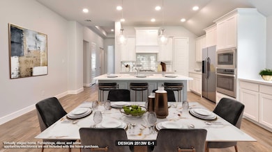 Dining area featuring light wood finished floors,