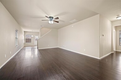 Unfurnished living room with visible vents, basebo