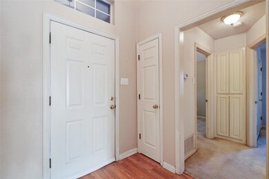 Entrance foyer with vinyl floors.
