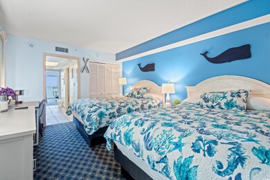 Carpeted bedroom featuring a closet and tile patterned floors