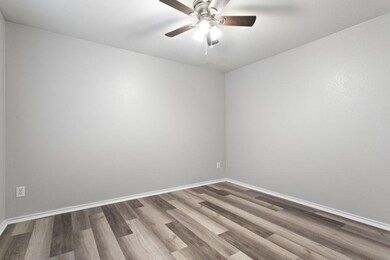 Unfurnished living room with wood-type flooring an