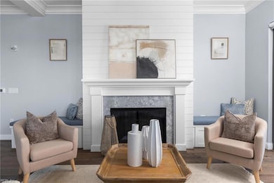 Open and spacious great room with cozy romantic fireplace.