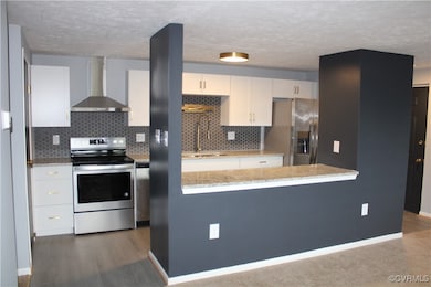 Kitchen featuring appliances with stainless steel
