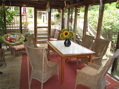 The screened in porch is ideal for enjoying summer