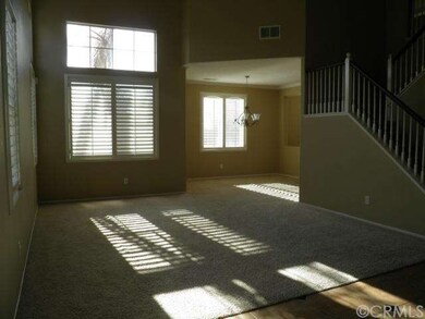 VIEW FROM FRONT DOOR INTO LIVING ROOM AND DINING R