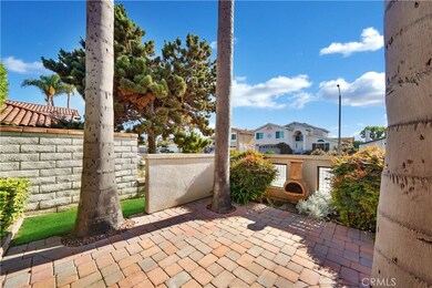 Front Courtyard with Interlocking Paver Decking, Glass Block Accent Wass, and Tropical Landscaping