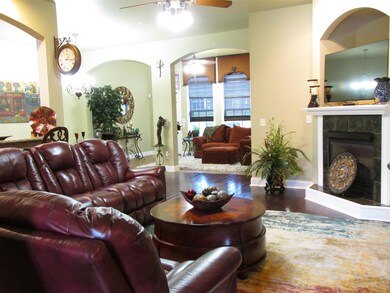 Family room has a gas fireplace, shelf above for your TV and plenty of space to sit and chill.