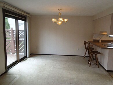 Dining room with slider to deck, breakfast bar & v