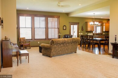 Open living space with large windows providing amp