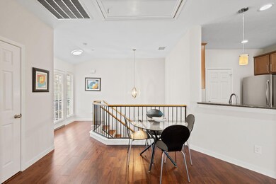 Corridor with an upstairs landing, dark wood-type