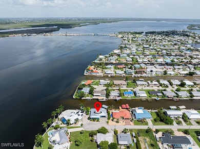 Aerial view featuring a water view and a residenti