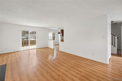 Rear Facing View of Family Room with Sliding Glass