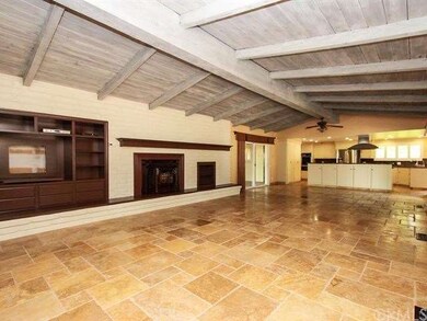 Rich Travertine throughout this remodeled home