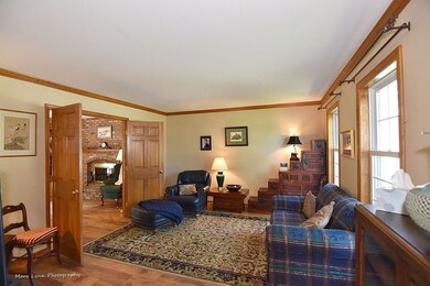 Spacious living room with doors separating family 