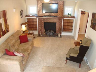 Living Room. Living room w/Built in Shelving and F