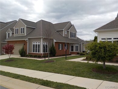 End unit offers tons of natural light and a two ca