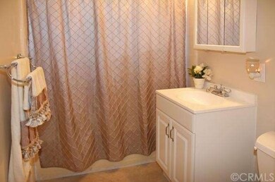 Upgraded Bathroom w/Tile Floor, Newer Vanity, & Light Fixtures