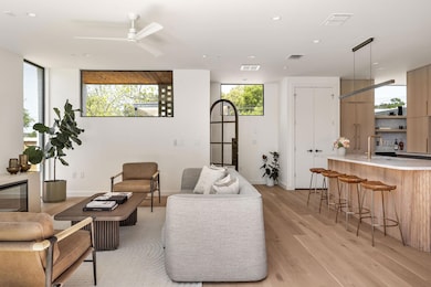 Living area with light wood-style flooring, ceili