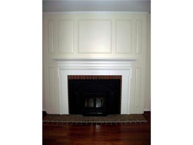 Living Room Beautiful mill work surrounds fireplac