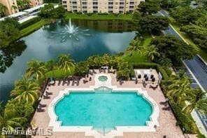 View of swimming pool with a water view