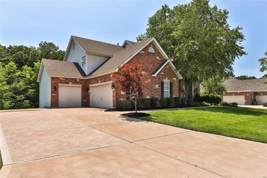 Large driveway with three car garage