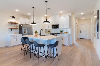 Kitchen with island and pendant lighting