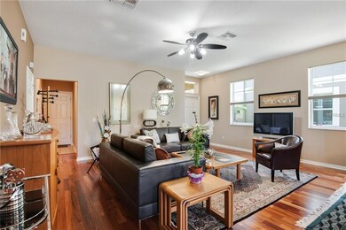 View of living room and side hallway, leading to t