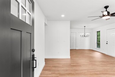 Entrance foyer featuring ceiling fan with notable 