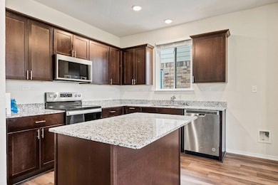 Kitchen featuring stainless steel appliances, a s