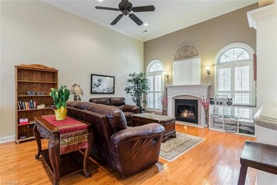 Plantation shutters cover the great room windows with palladium arch. Gas log fireplace.