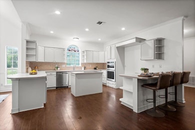 Kitchen with open shelves, stainless steel applia