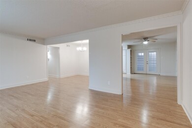 Empty room featuring visible vents, light wood-sty