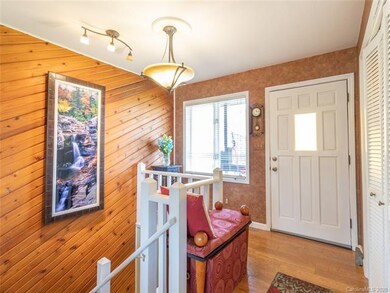 The entry hall and stairs to the lower level.
