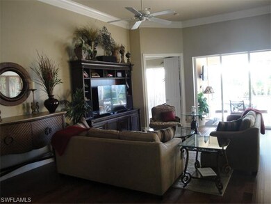 Great room with hardwood floors, and double crown 