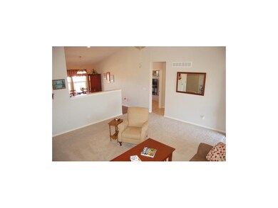 Living room opens to kitchen.  Master bedroom in b